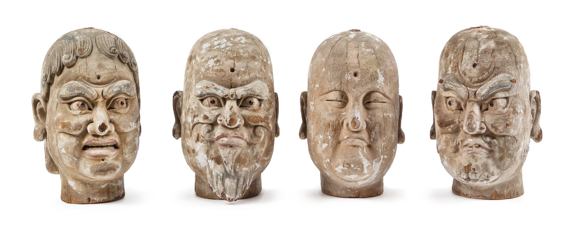 Four Carved Wood Heads of Luohan Height of each 12 inches. — LIKELY MING DYNASTY (1368-1644)