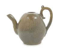 A Korean Celadon Glazed Stoneware Ewer 12TH/13TH CENTURY, KORYO DYNASTY Height over handle 7 3/4 inches. — 12TH/13TH CENTURY, KORYO DYNASTY