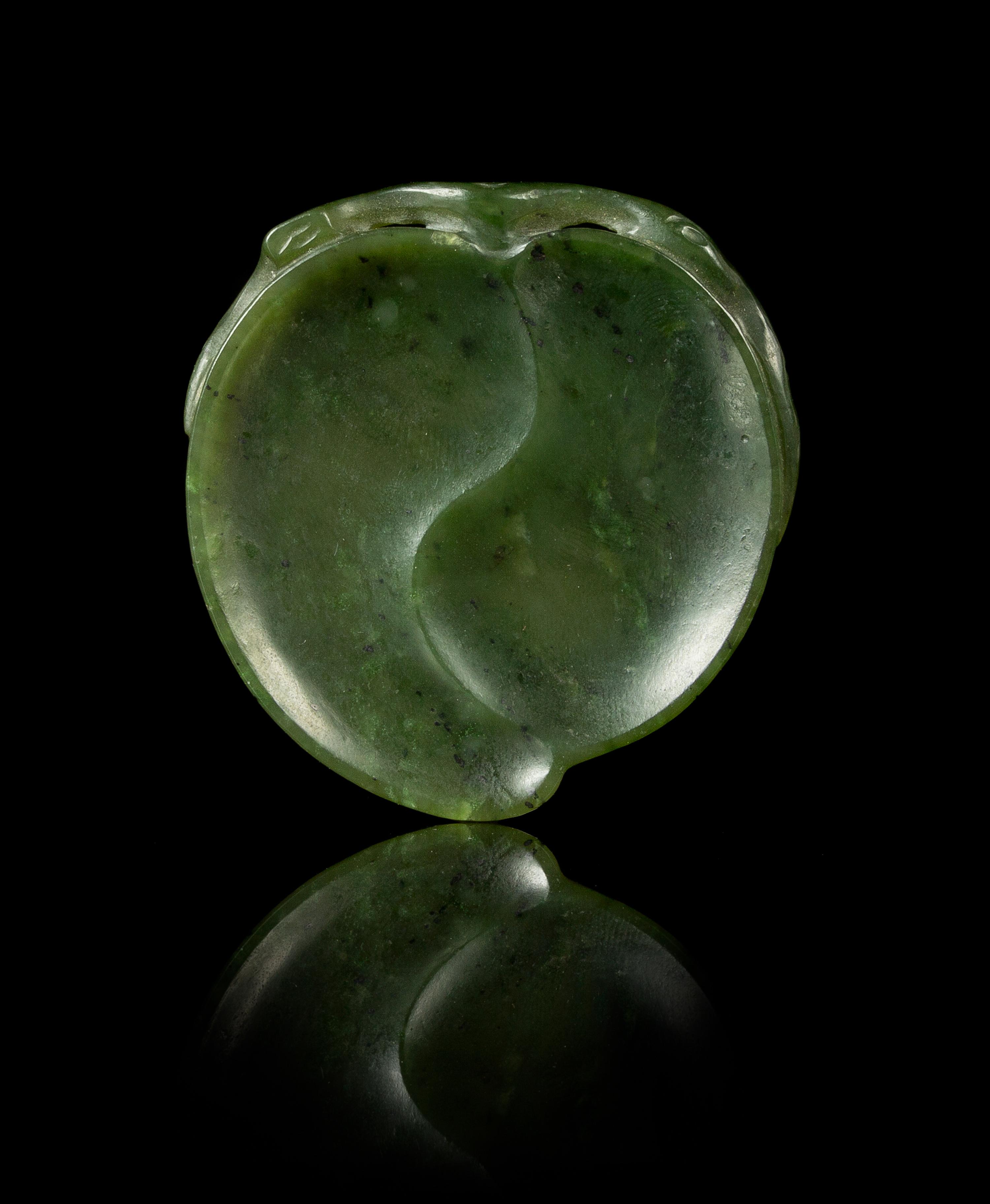 A Small Spinach Jade Peach-Form Brush Rest Length 2 1/8 inches.