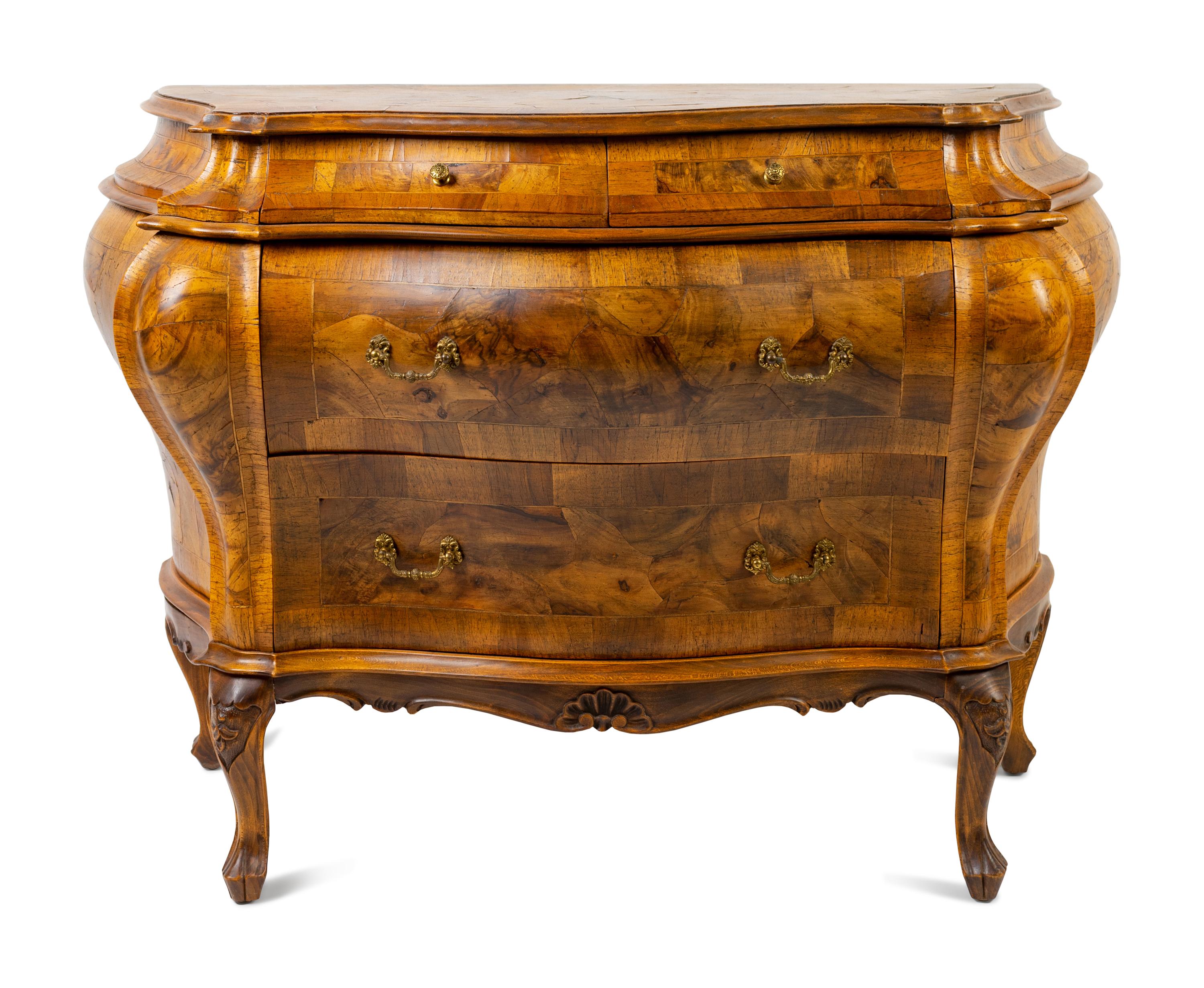 An Italian Rococo Style Olivewood Bombe Commode