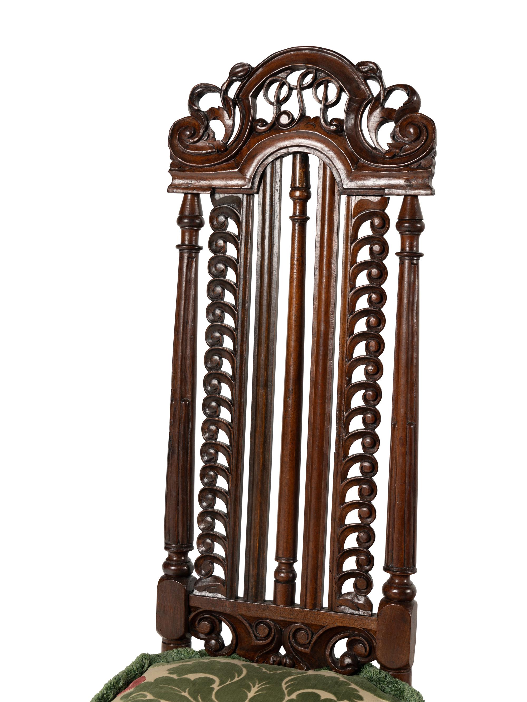 A Pair of William and Mary Style Carved Walnut Side Chairs