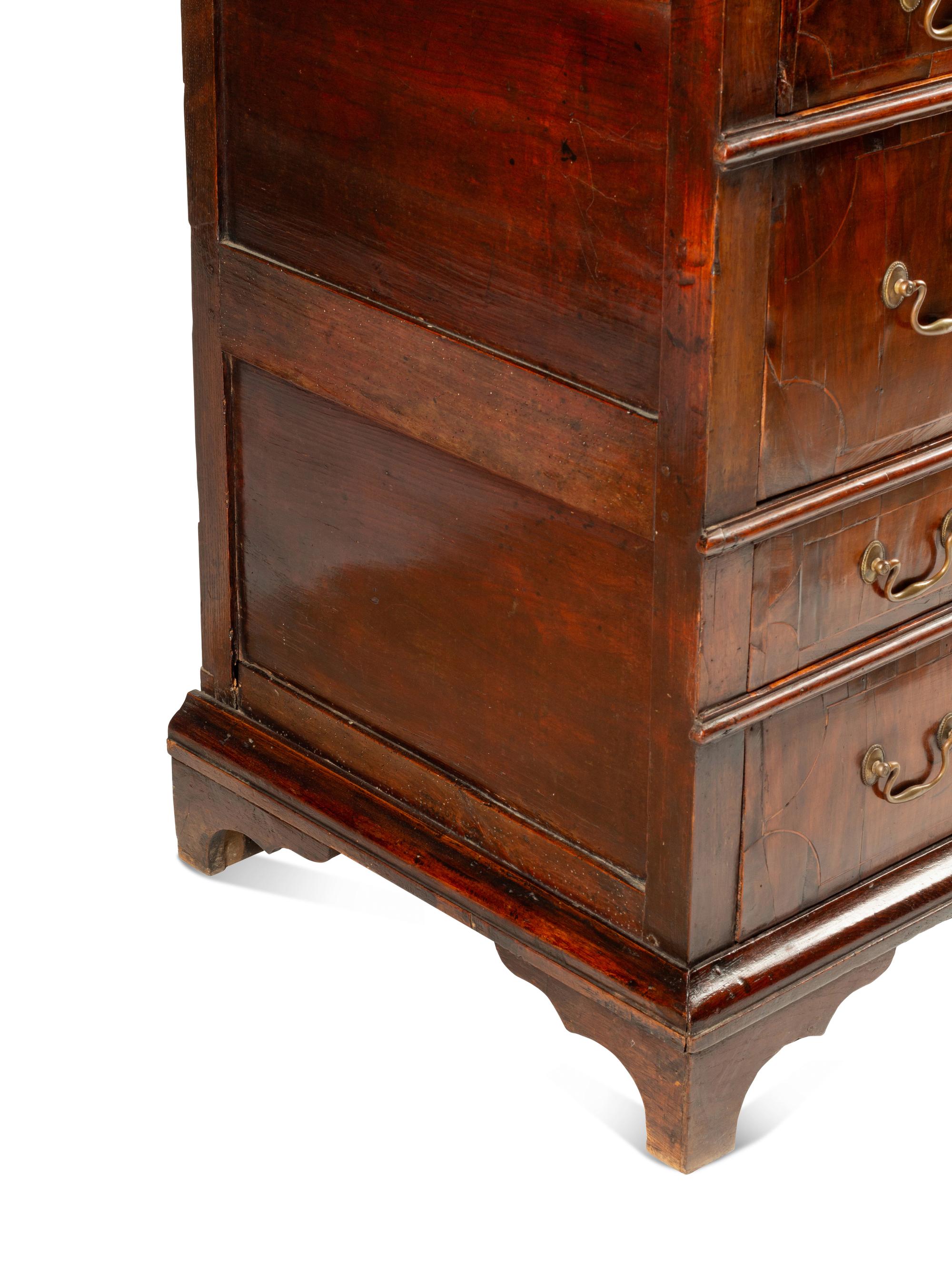 A George II Walnut and Oak Chest of Drawers