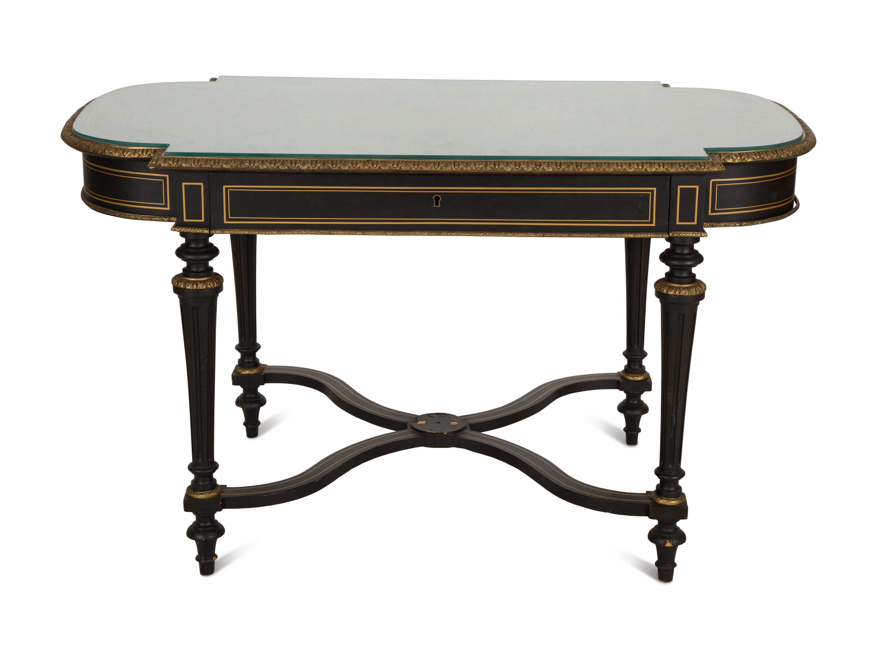 A Napoleon III Style Gilt-Bronze Mounted Ebonized Center Table