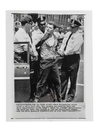 [CIVIL RIGHTS]. Press photograph of Washington, DC, police arresting a white male for purportedly heckling demonstrators during a "march for freedom." Washington, DC, 15 June 1963.