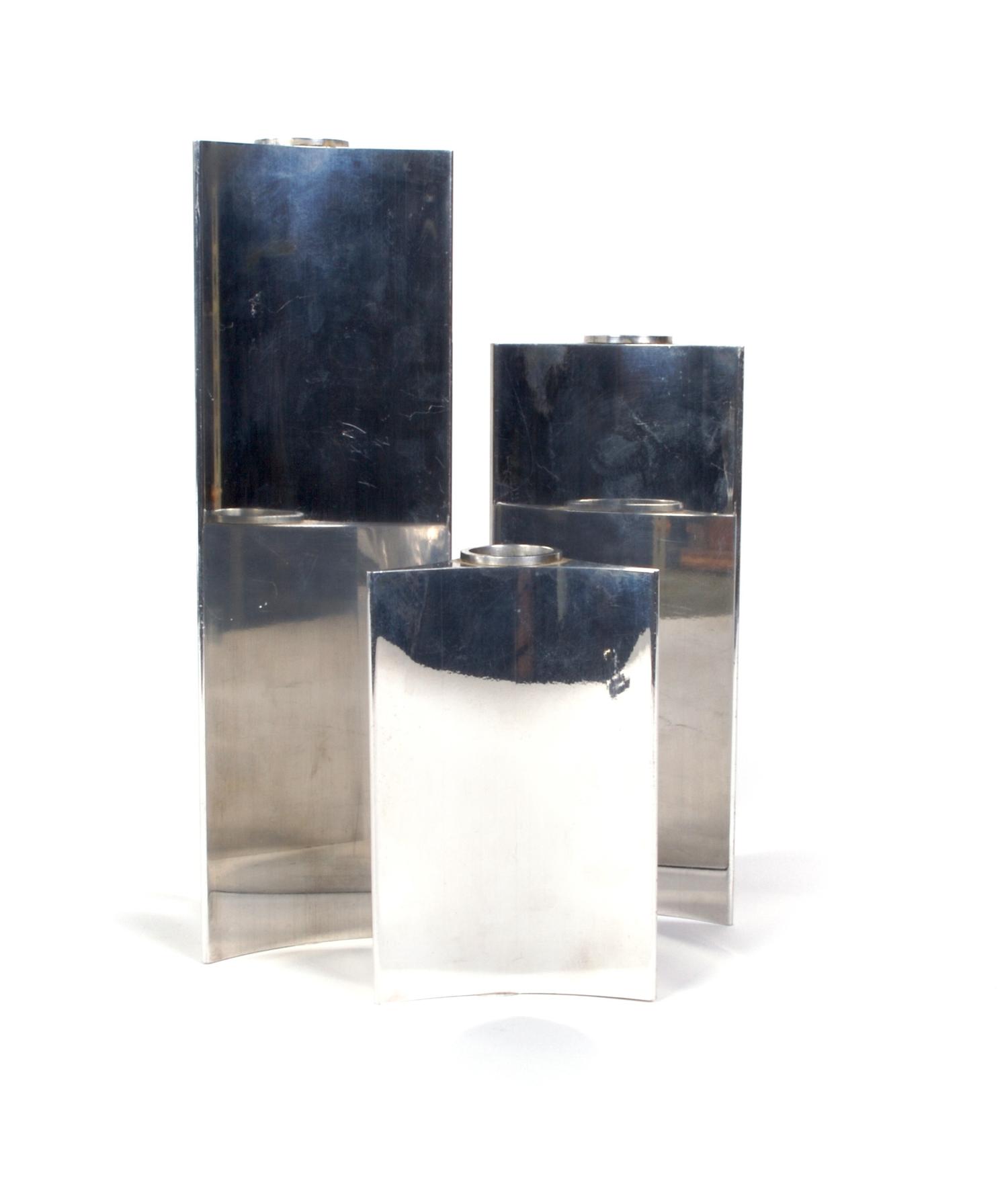 A Set of Three Danish Graduated Candlesticks, Georg Jensen, Height of tallest 9 1/4 inches.