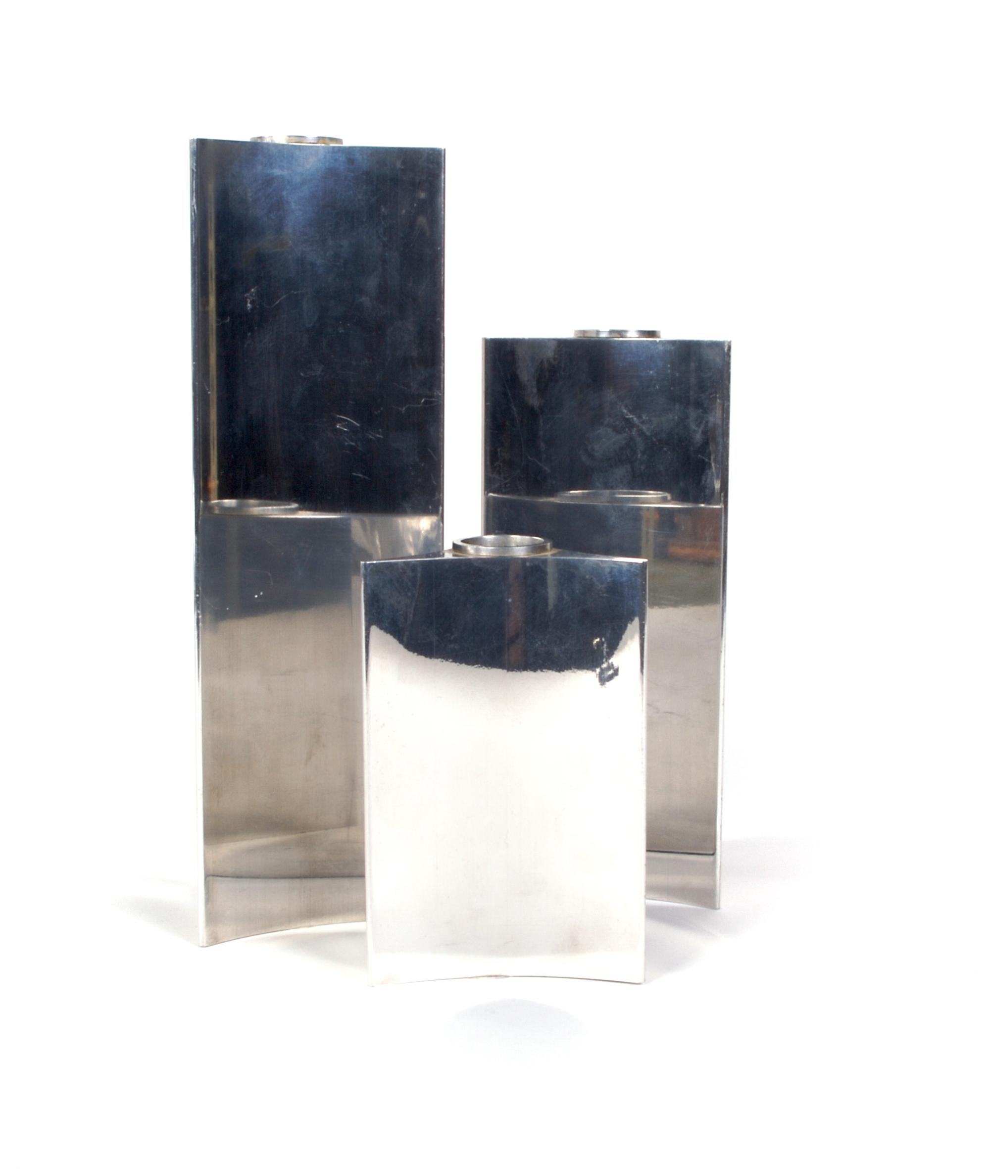 A Set of Three Danish Graduated Candlesticks, Georg Jensen, Height of tallest 9 1/4 inches.