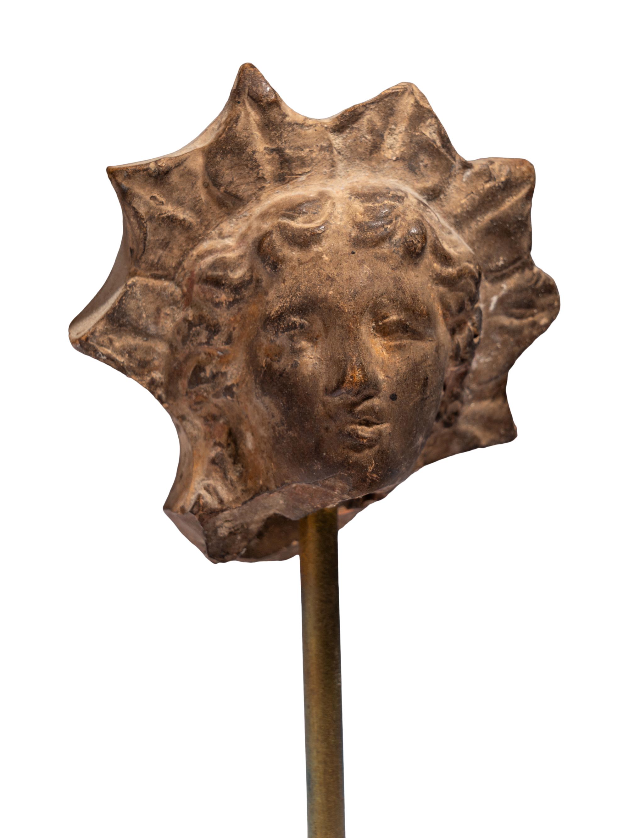 A Greek Terracotta Head of Helios