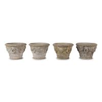 A Set of Four Cast Stone Jardinières