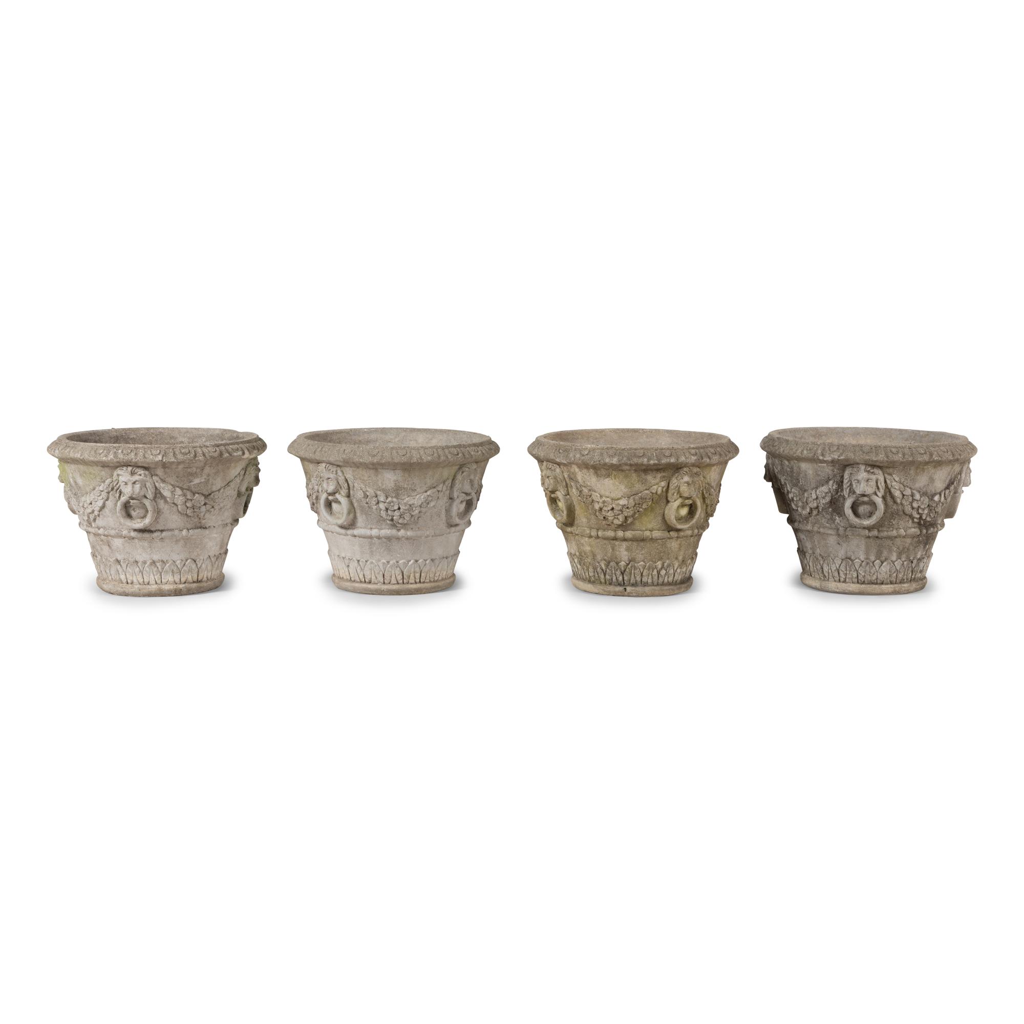 A Set of Four Cast Stone Jardinières