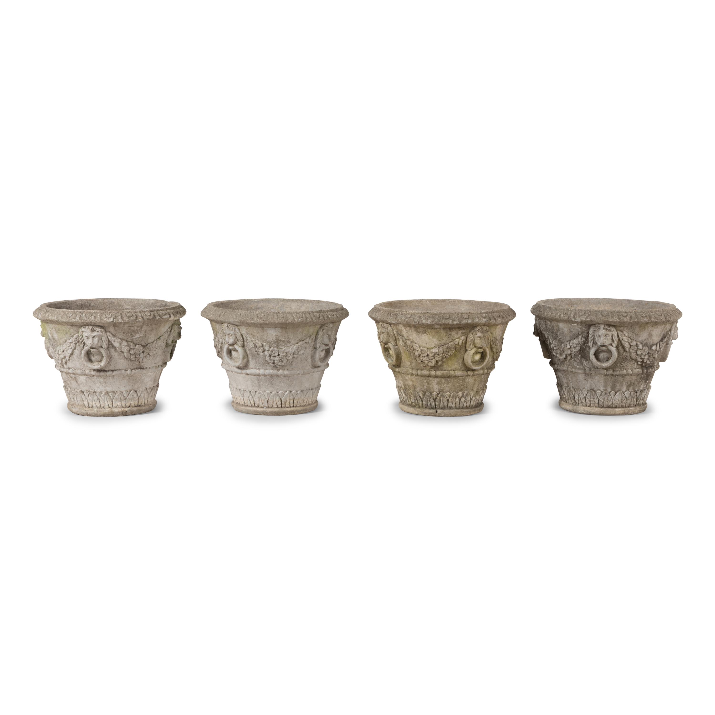 A Set of Four Cast Stone Jardinières
