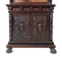 An Austrian Carved Walnut Cabinet