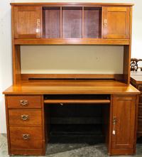 An Arts and Crafts Style Desk. Height 70 1/2 x width 60 x depth 30 inches.