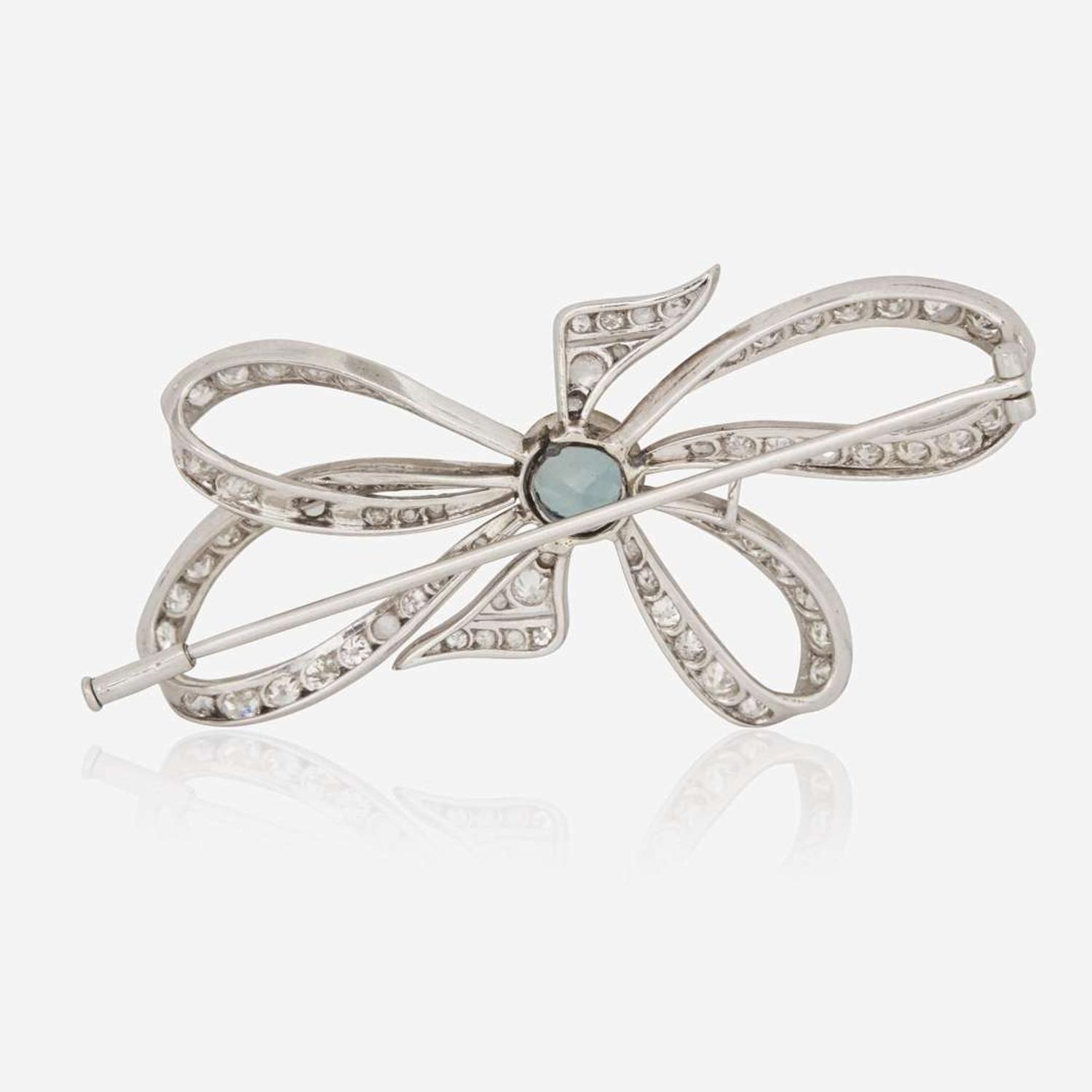 A Platinum, Diamond, and Blue Zircon Brooch