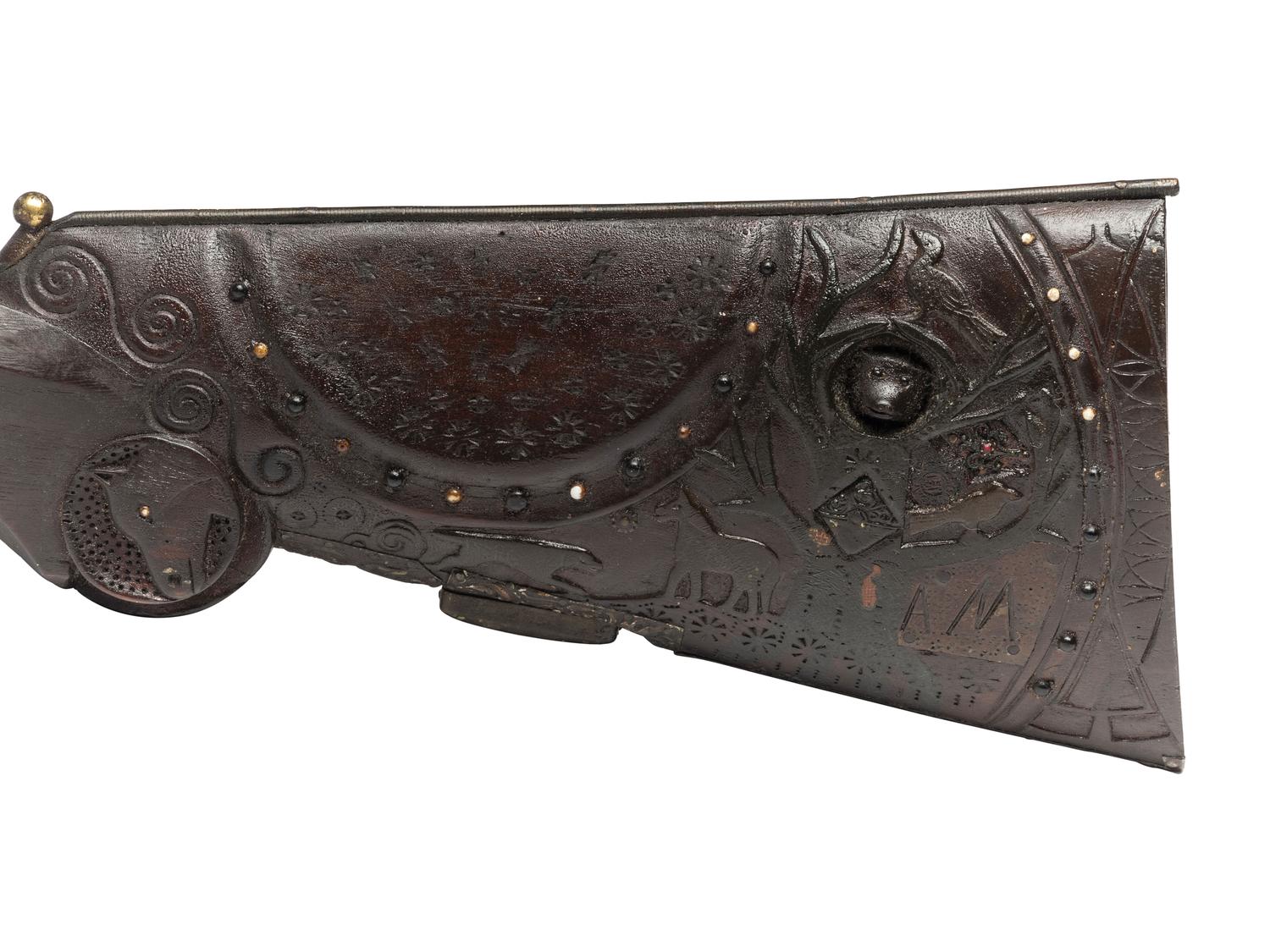 A Folk Art Carved and Punch Decorated Painted Ash Rifle Stock