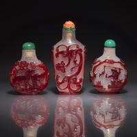 Three Chinese Ruby-Overlay Glass Snuff Bottles, 18th-19th Century — 清中期 雪霏地套寶石紅料鼻烟壺三支
