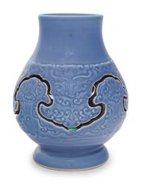A Claire-de-Lune Glazed Carved Porcelain Reticulated Vase