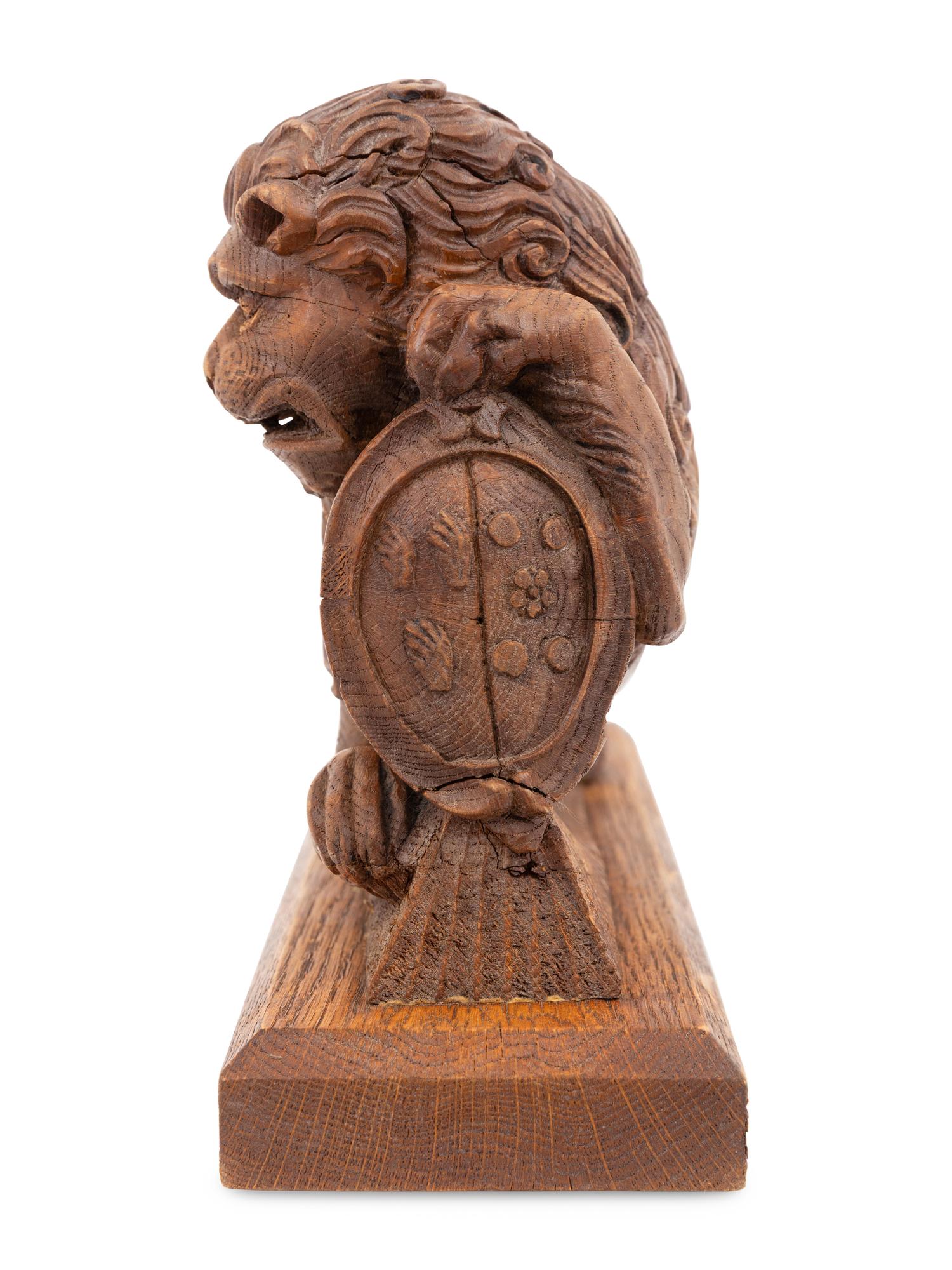 A Carved Oak Newel Post Figure of a Lion