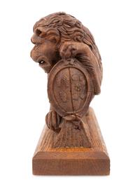 A Carved Oak Newel Post Figure of a Lion