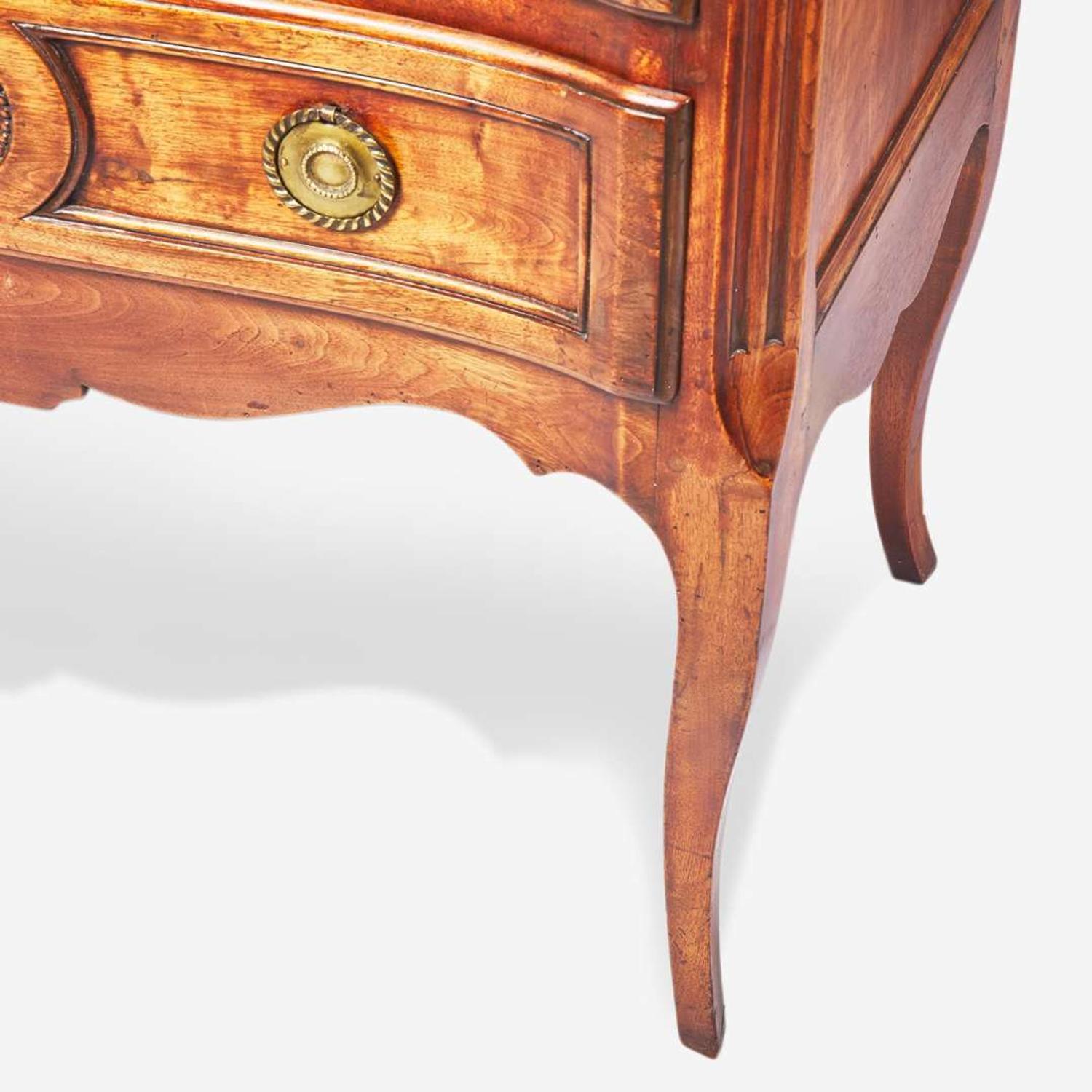 A French Directoire carved walnut commode circa 1800