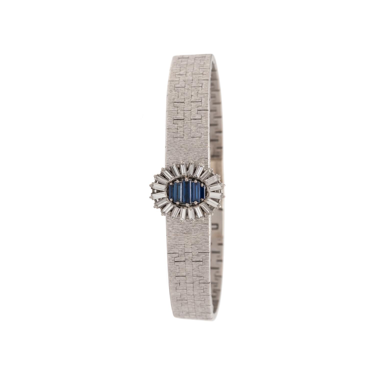 PIAGET, 18K WHITE GOLD, DIAMOND AND SAPPHIRE SURPRISE WATCH