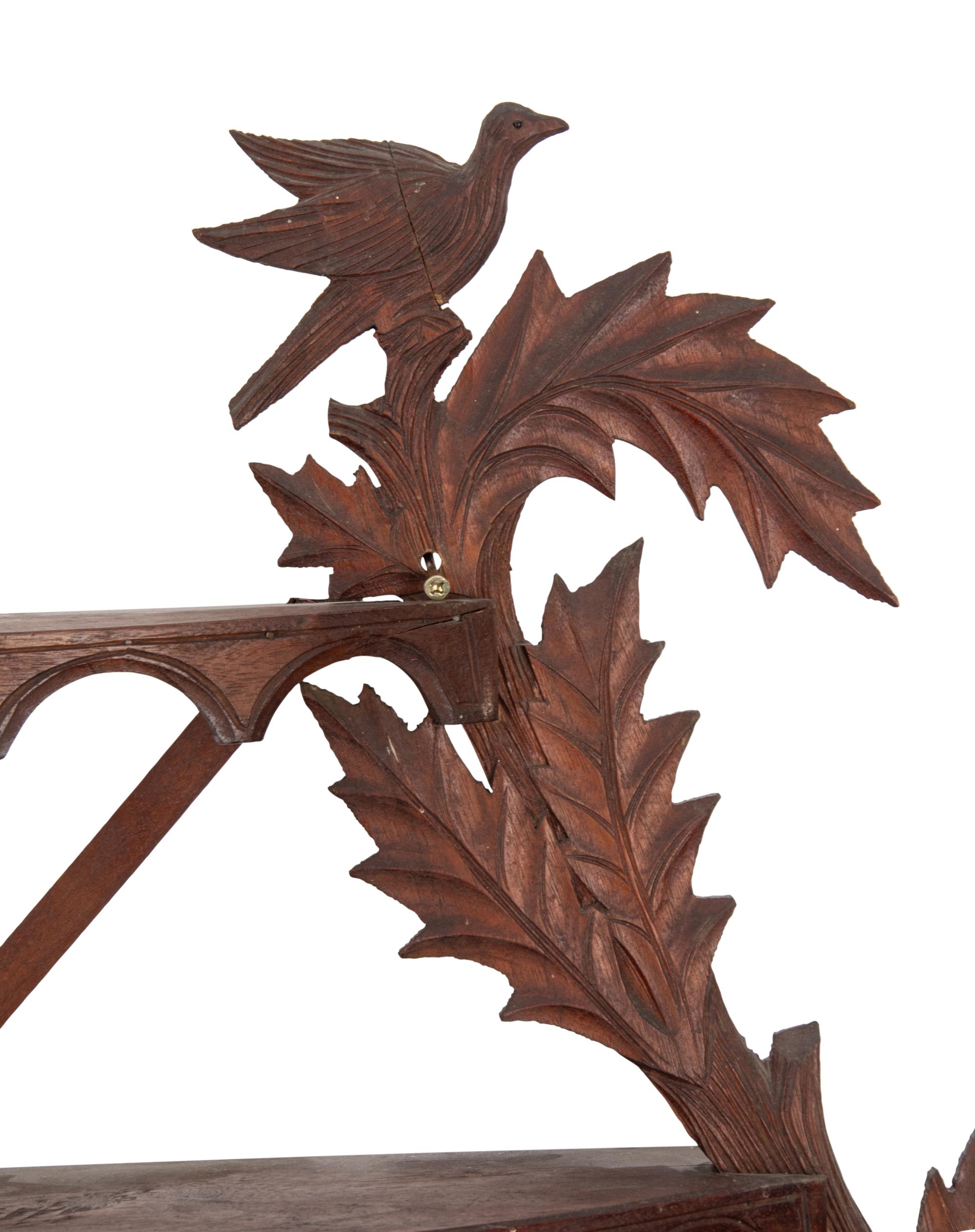 A Folk Art Carved Walnut Figural Wall Shelf