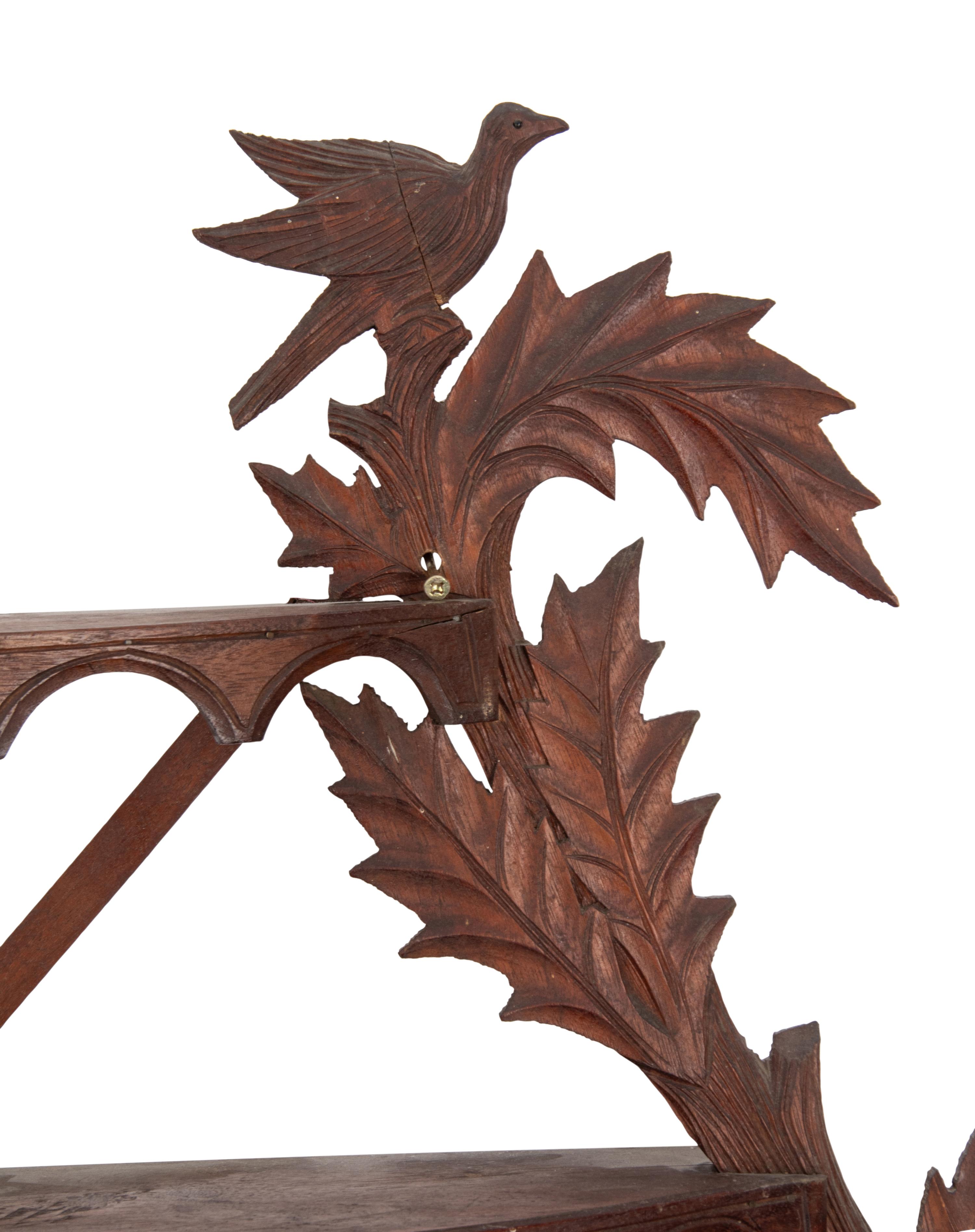 A Folk Art Carved Walnut Figural Wall Shelf