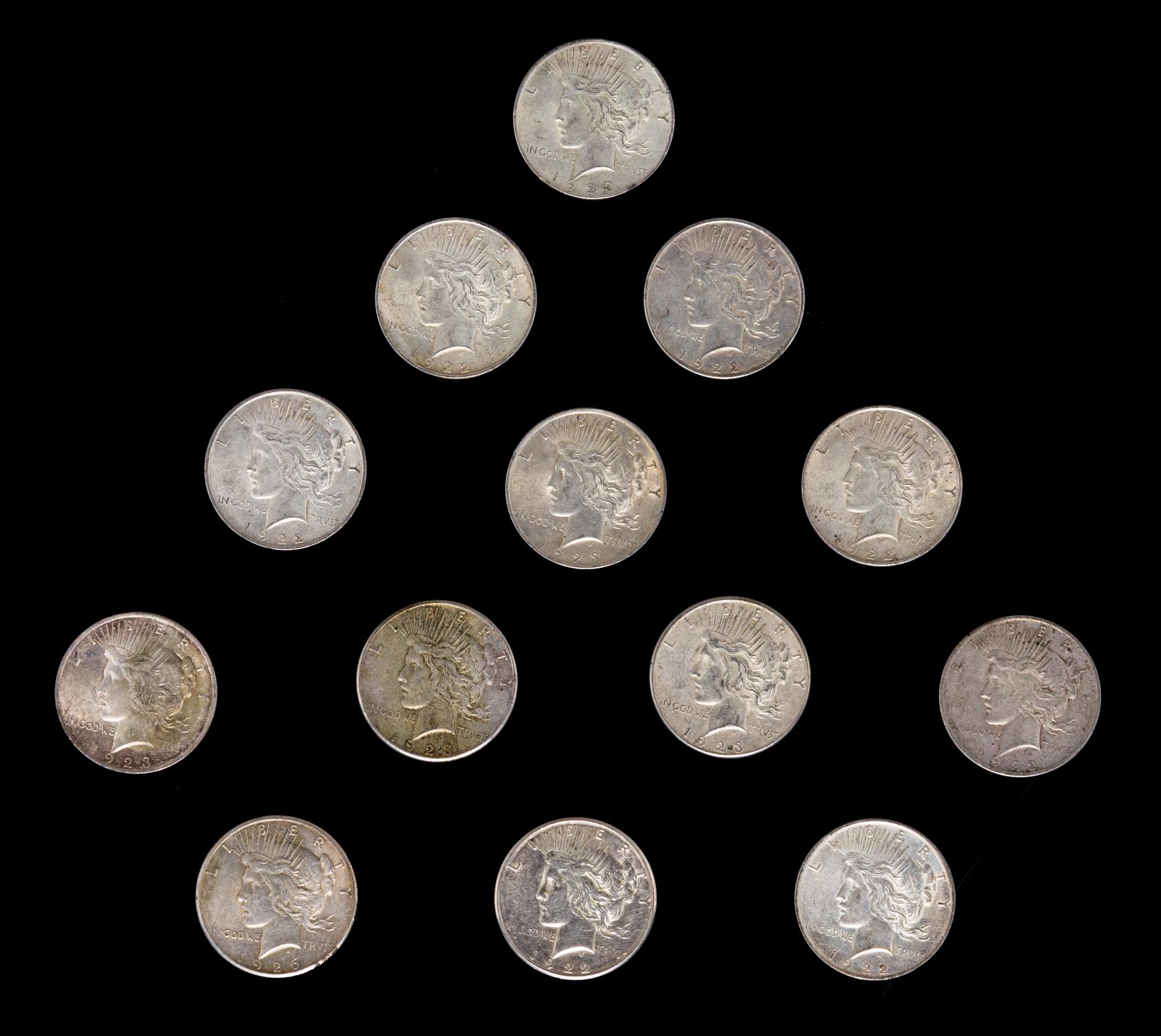 A Group of Thirteen United States Peace Silver Dollar Coins