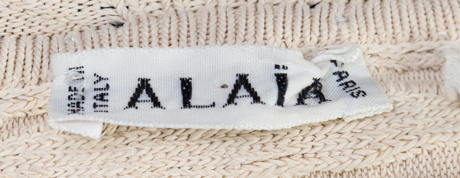 An Alaia Cream Ribbed Knit Dress, Size L.