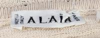 An Alaia Cream Ribbed Knit Dress, Size L.