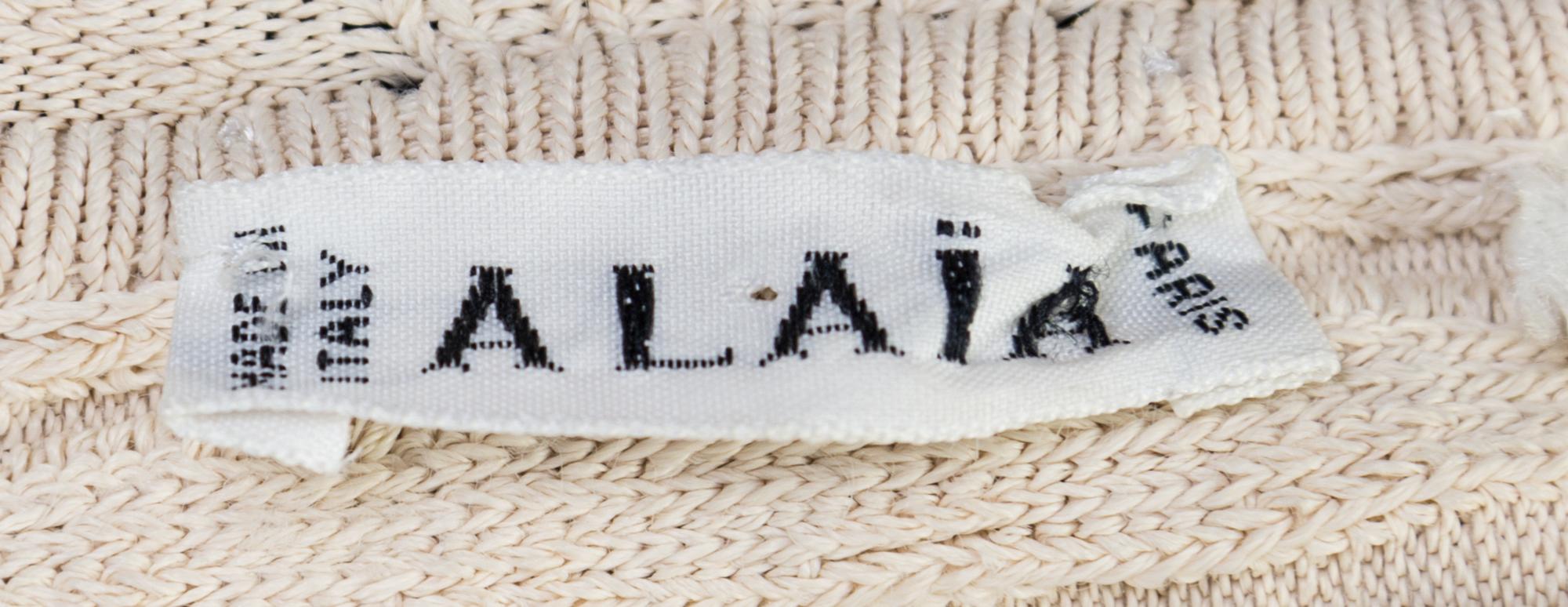 An Alaia Cream Ribbed Knit Dress, Size L.
