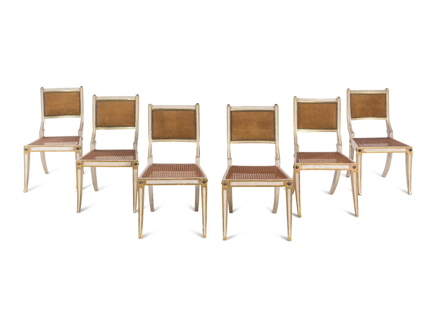 A Set of Six Continental Painted and Parcel Gilt Klismos Dining Chairs