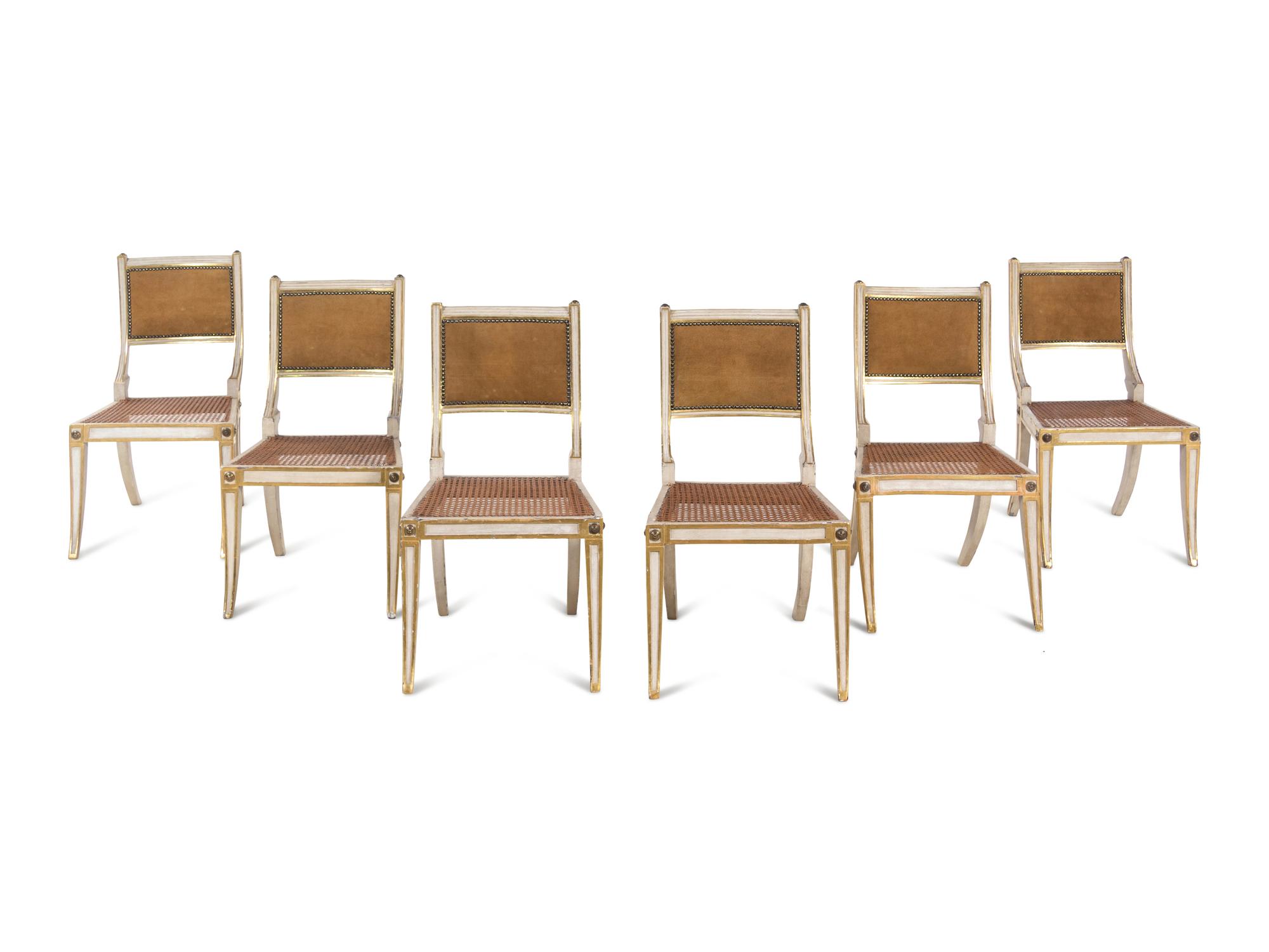 A Set of Six Continental Painted and Parcel Gilt Klismos Dining Chairs
