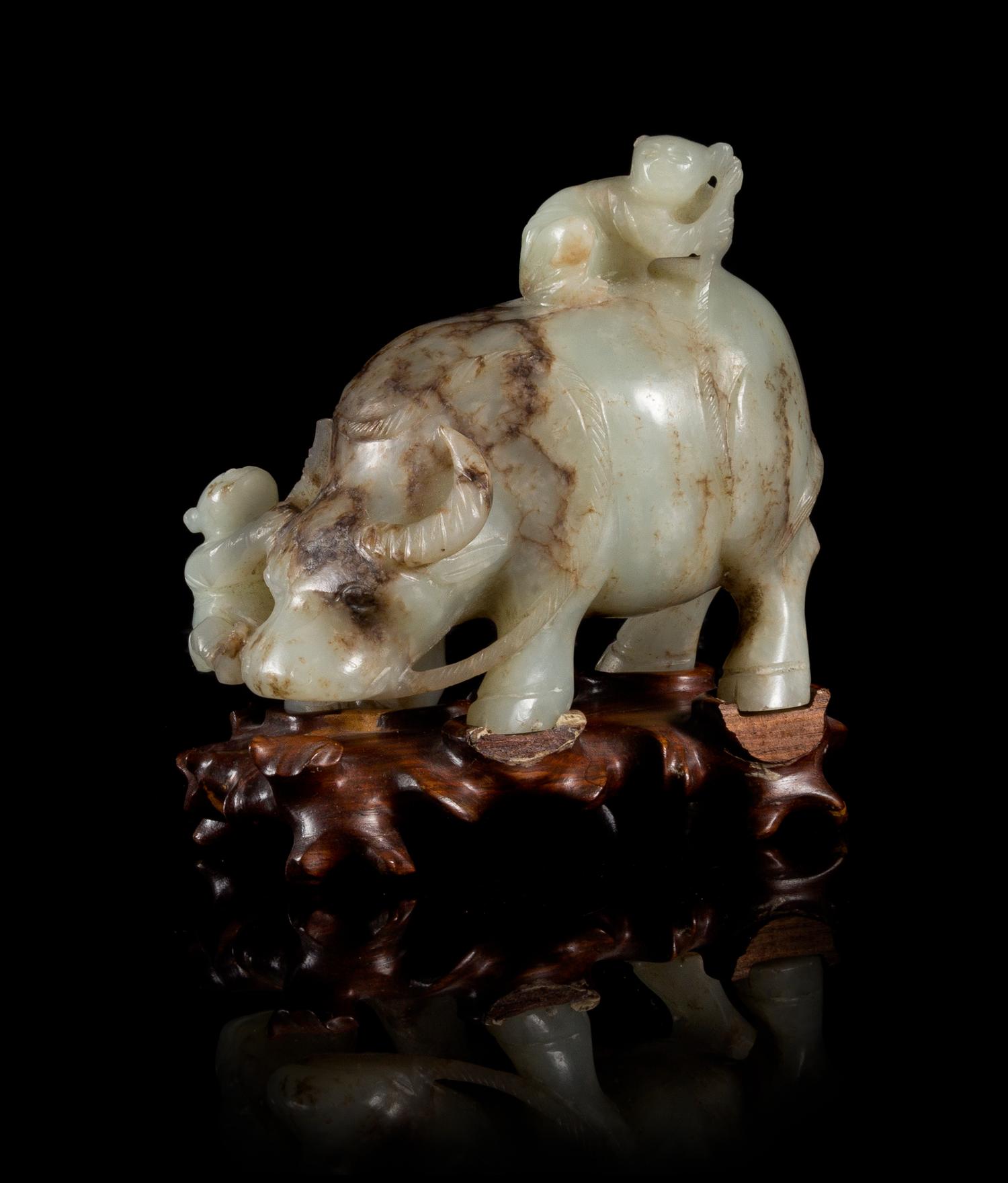A Celadon Jade Figural Group of Boys and Buffalo Length 3 3/4 inches.