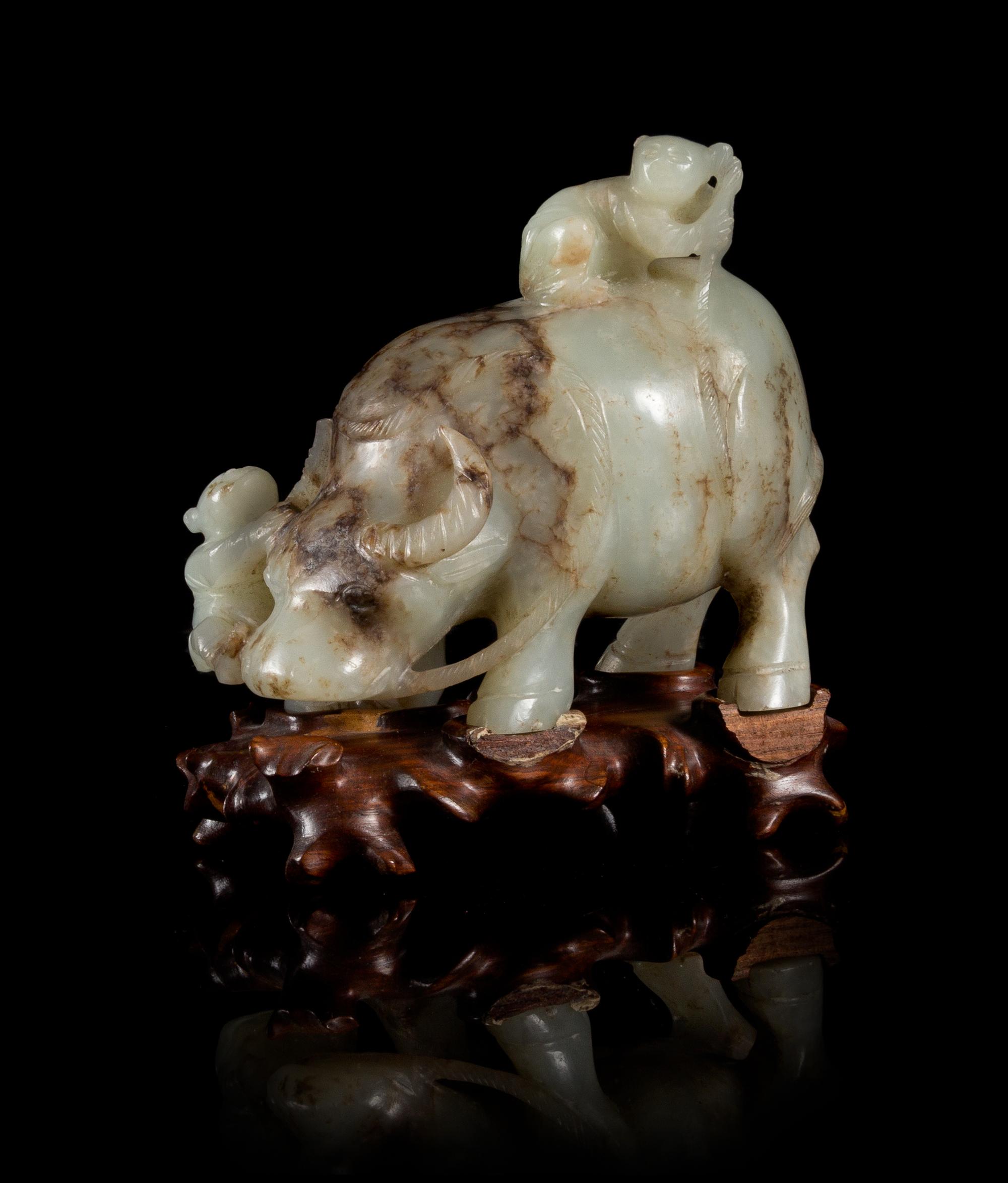 A Celadon Jade Figural Group of Boys and Buffalo Length 3 3/4 inches.