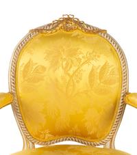 A Matched Pair of George III White-Painted and Parcel-Gilt Armchairs