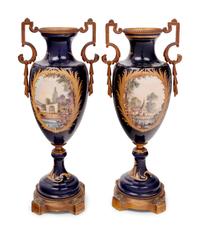 A Pair of Sèvres Style Gilt Bronze Mounted Porcelain Urns