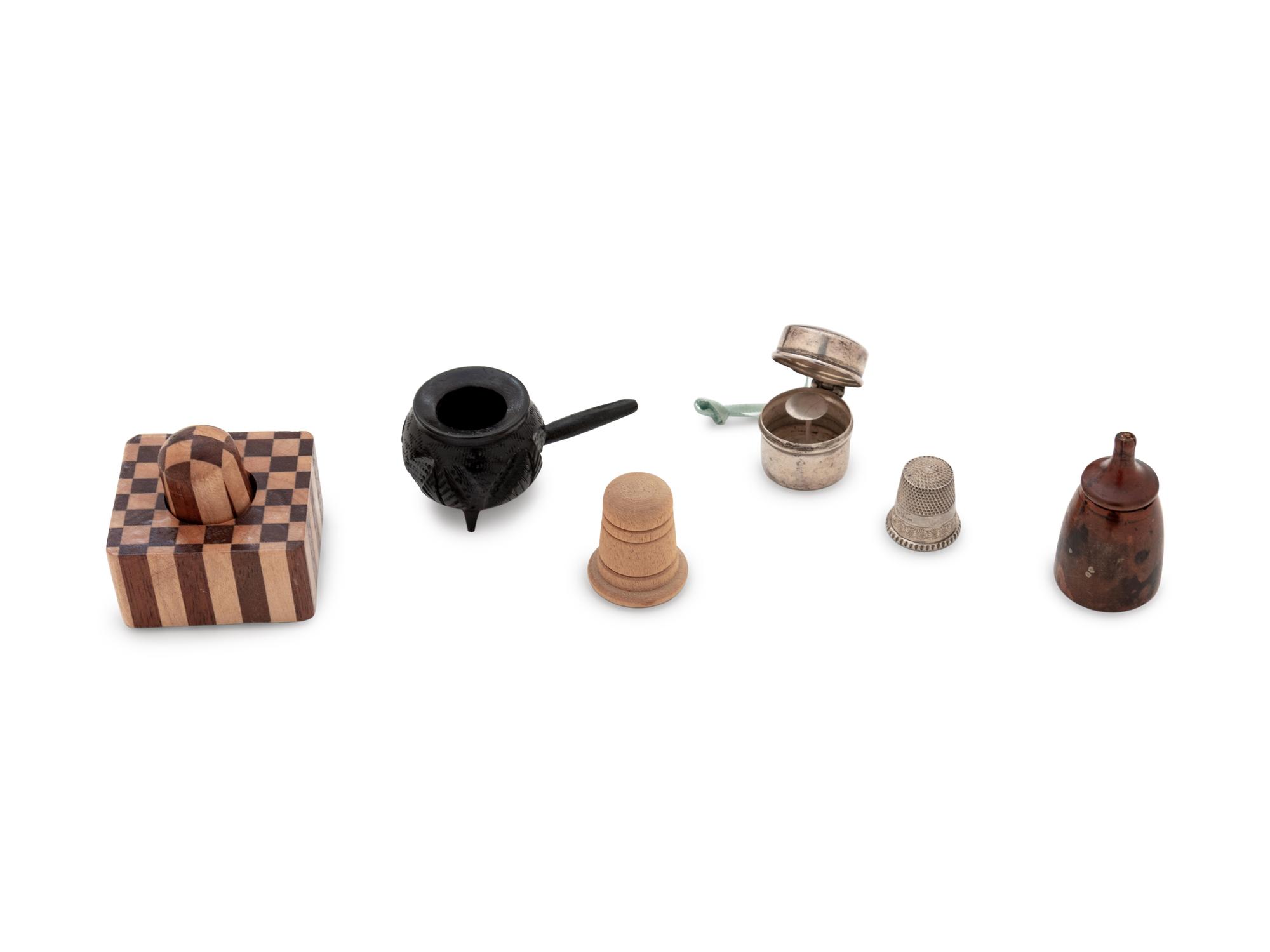 A Velvet-Clad Needlework Box, a Porcelain "Doll" Pin Cushion and a Collection of Thimble Cases