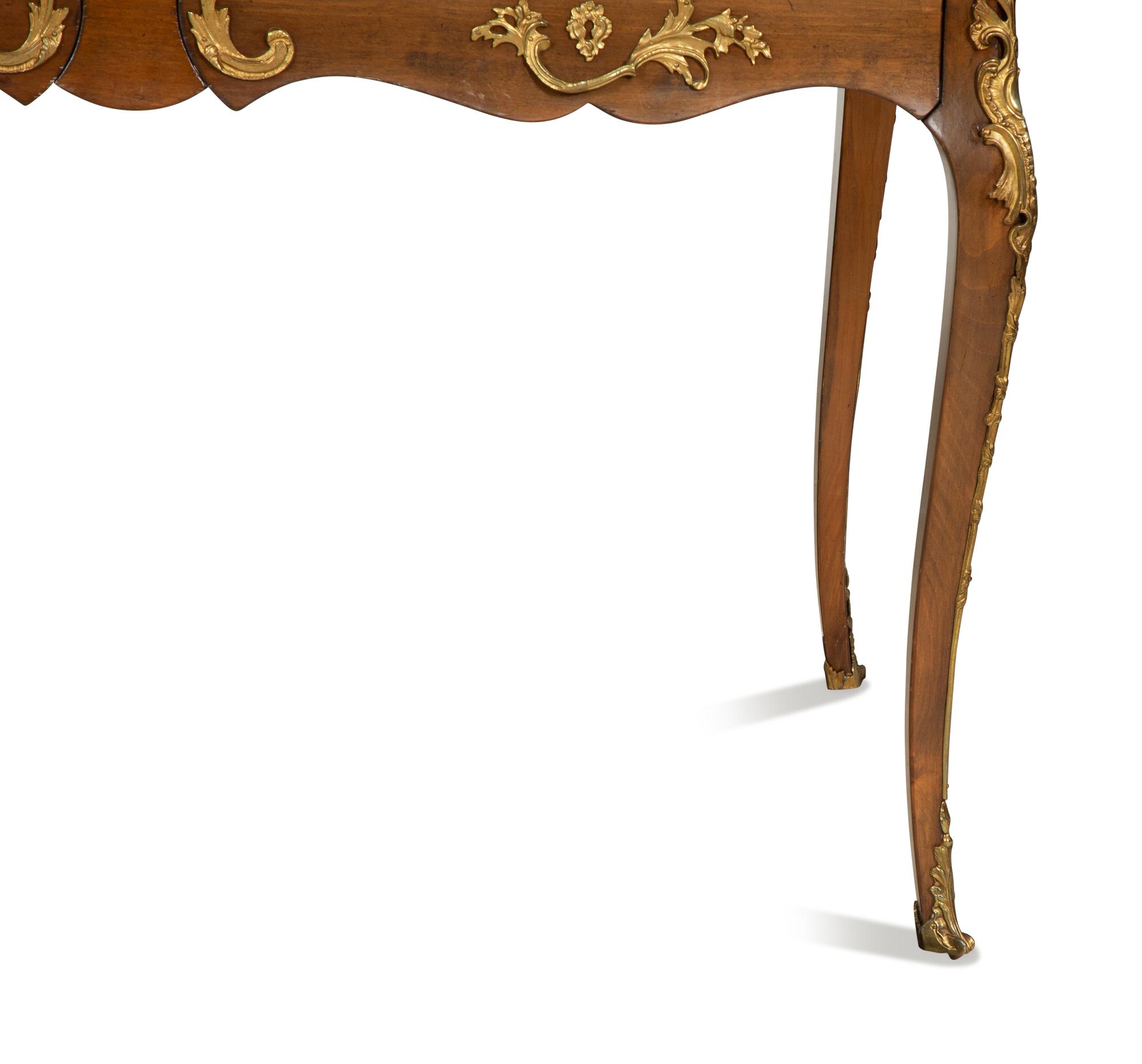 A Louis XV Style Gilt Metal Mounted Walnut Bureau Plat