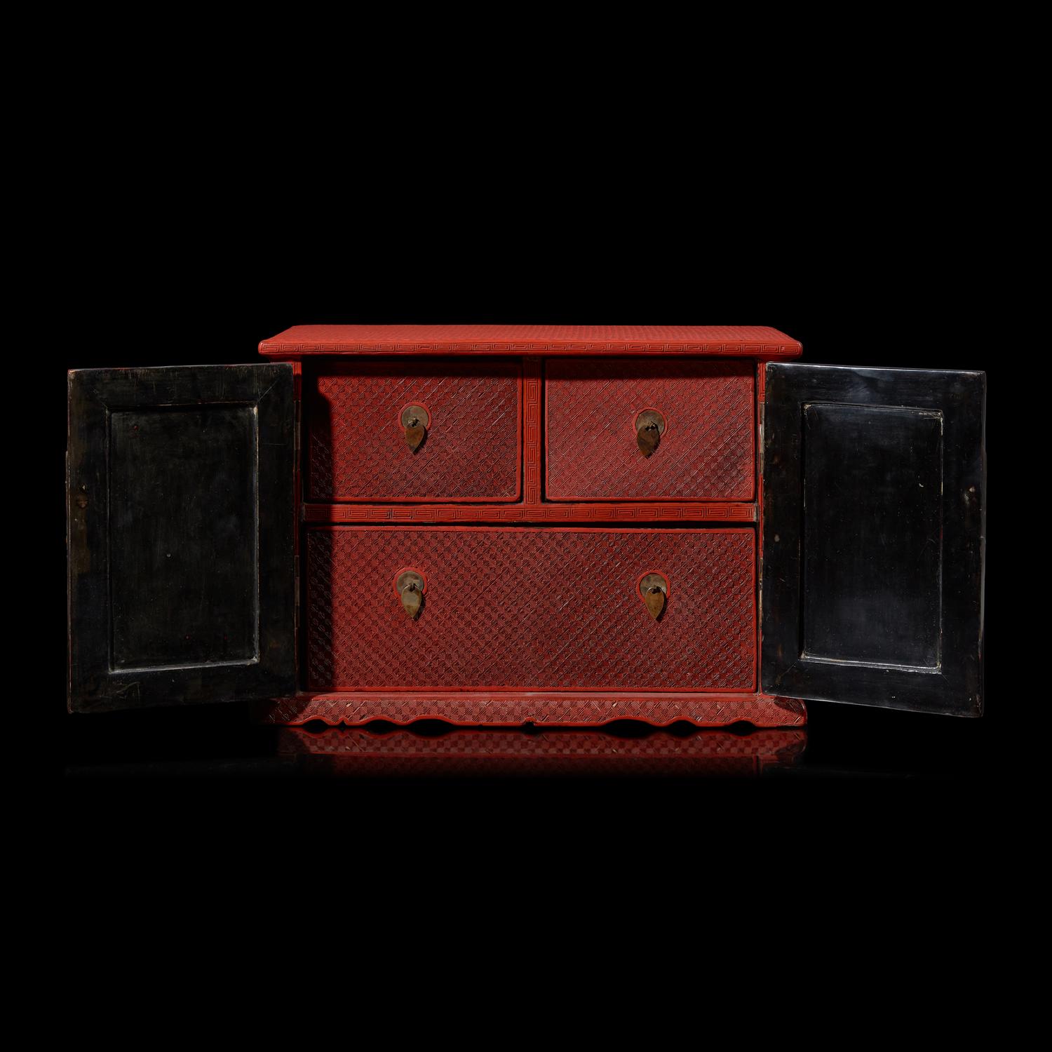 A Chinese Carved Cinnabar Lacquer Two-Door Small Cabinet, Late 19th/20th Century 清末民國 剔紅百寶箱