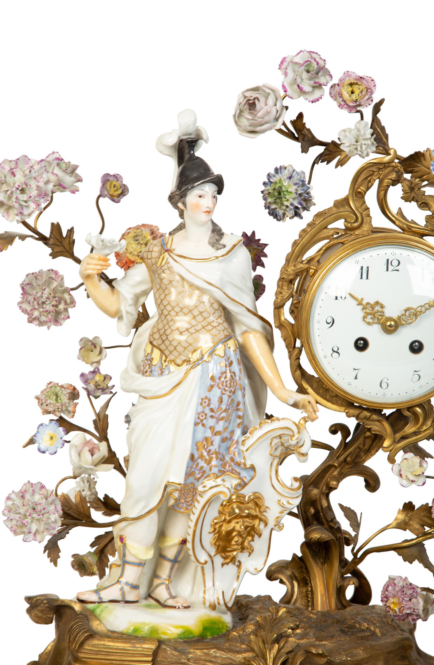 A Continental Gilt Bronze and Porcelain Figural Mantel Clock