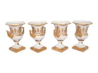A Set of Four Gilt-Decorated Porcelain Urns