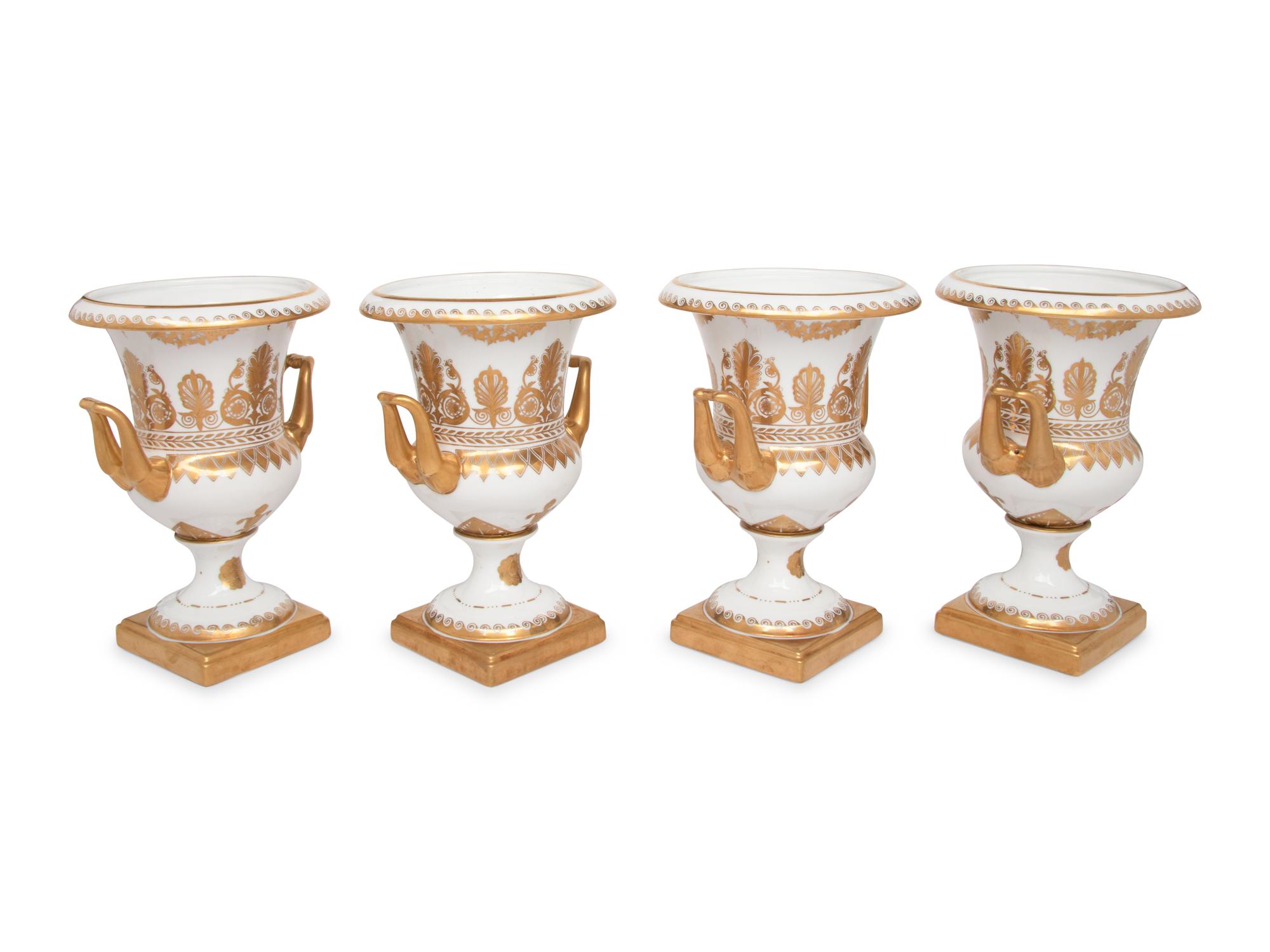 A Set of Four Gilt-Decorated Porcelain Urns