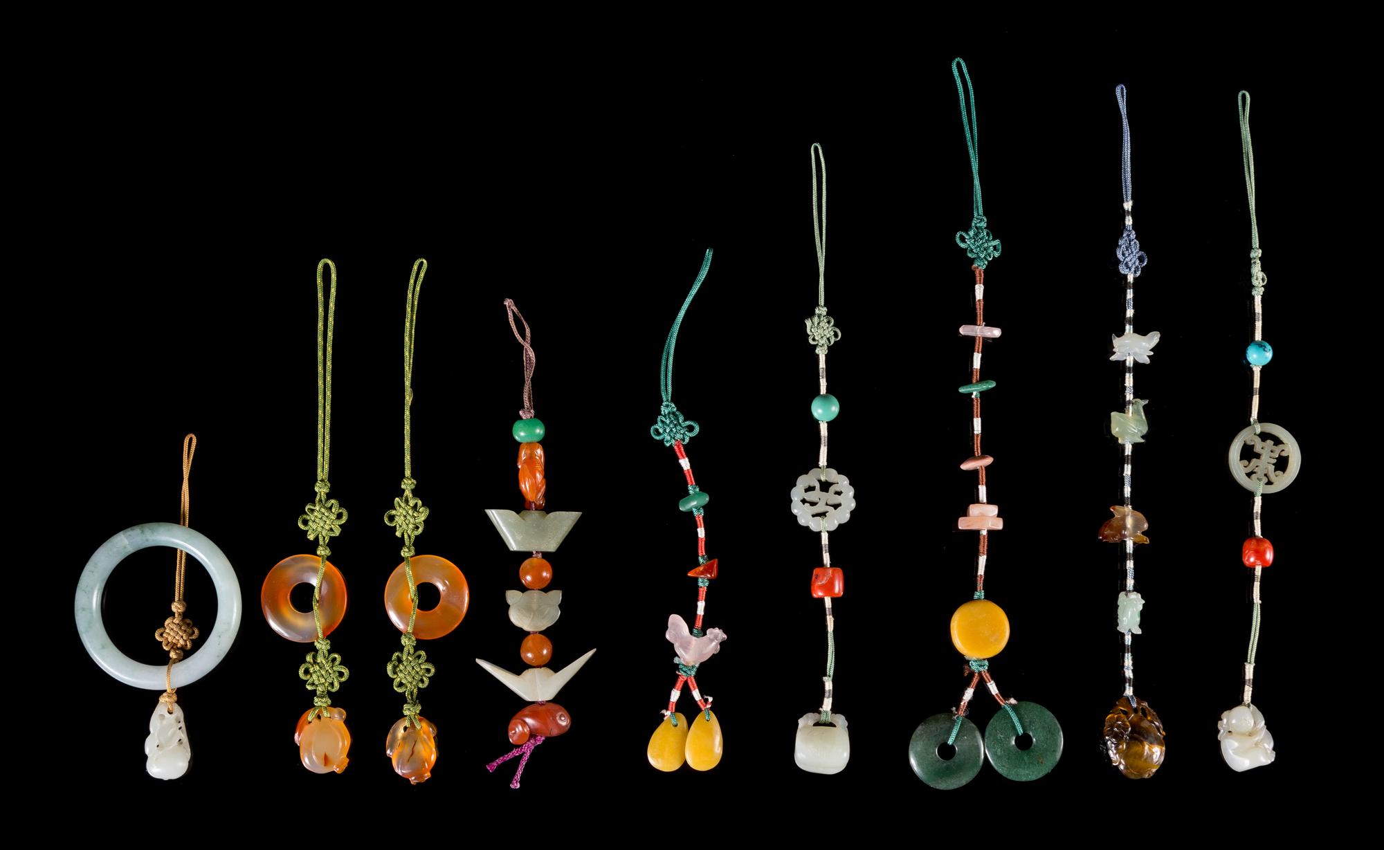 A Collection of Nine Jade Toggle Lanyards Length of longest 9 1/4 inches.