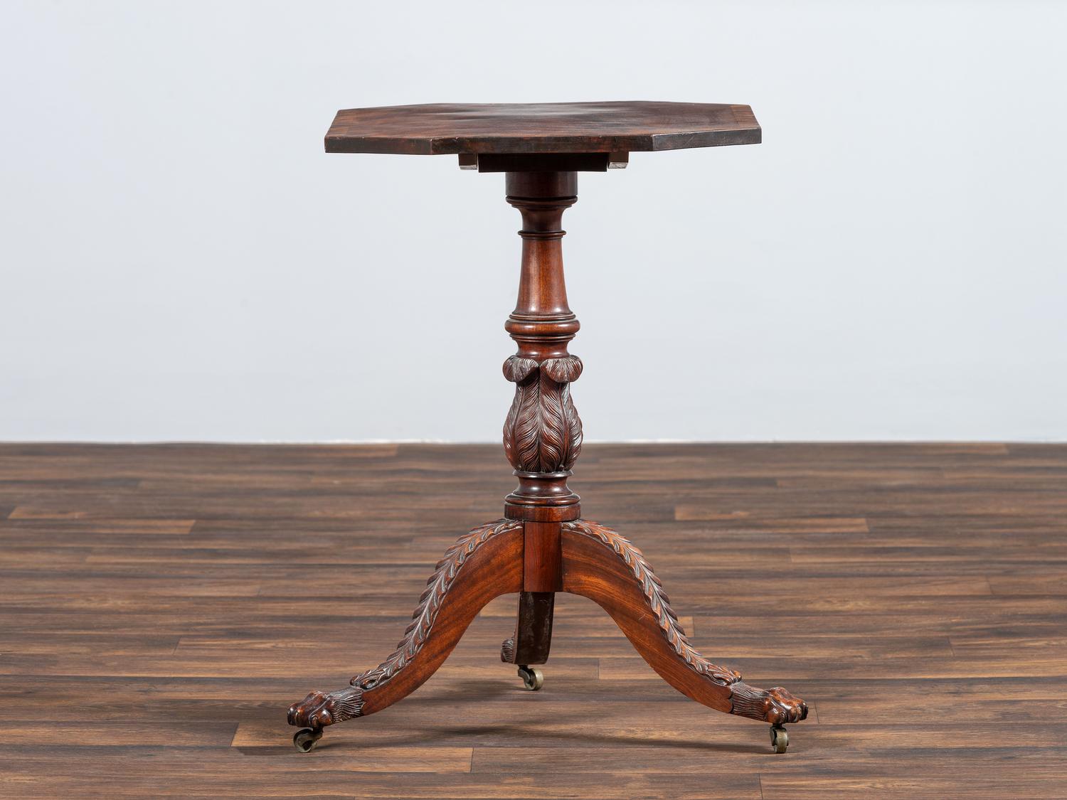 A Late Federal Carved and Figured Mahogany Octagonal Tilt-Top Candlestand