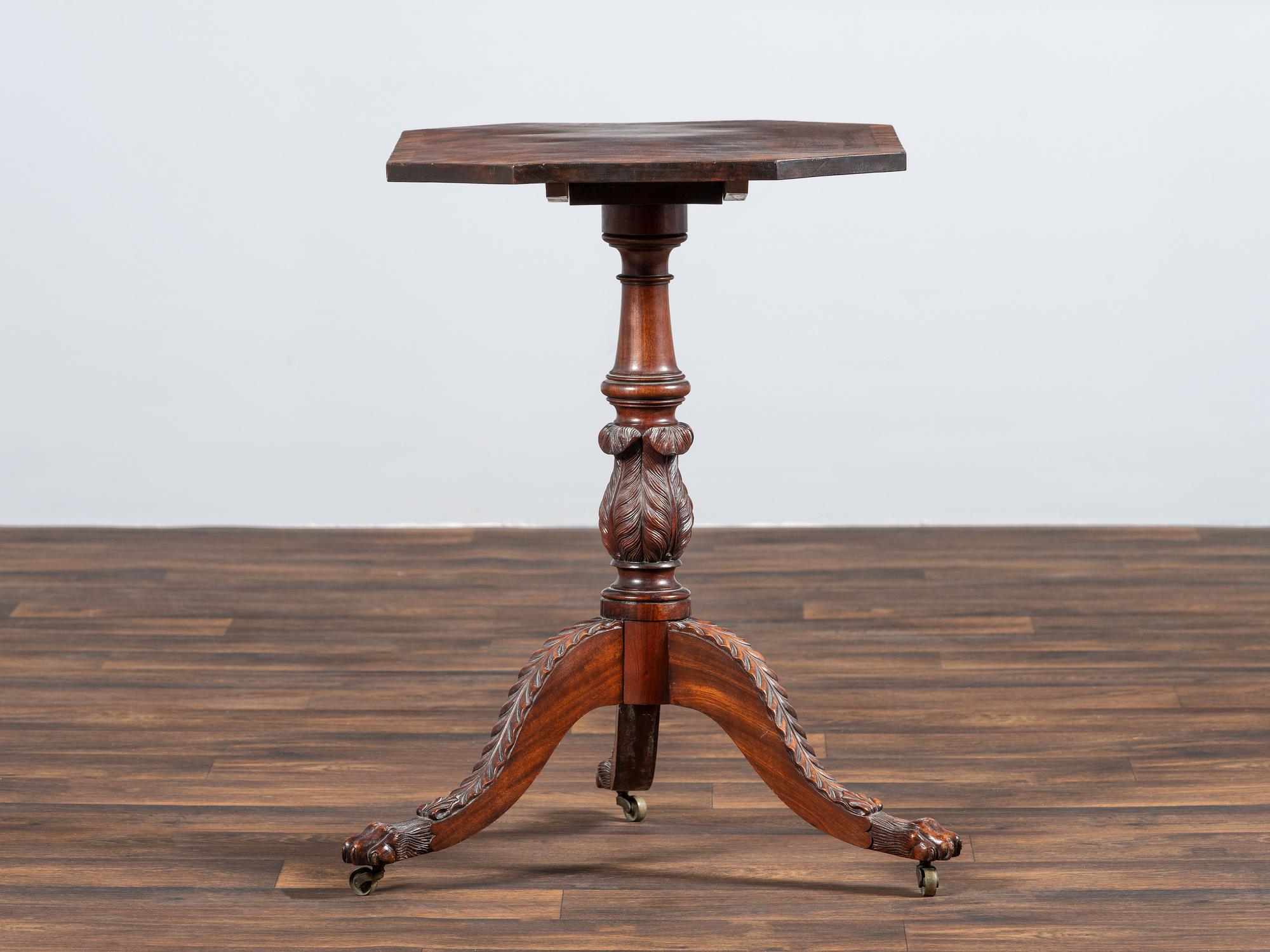 A Late Federal Carved and Figured Mahogany Octagonal Tilt-Top Candlestand
