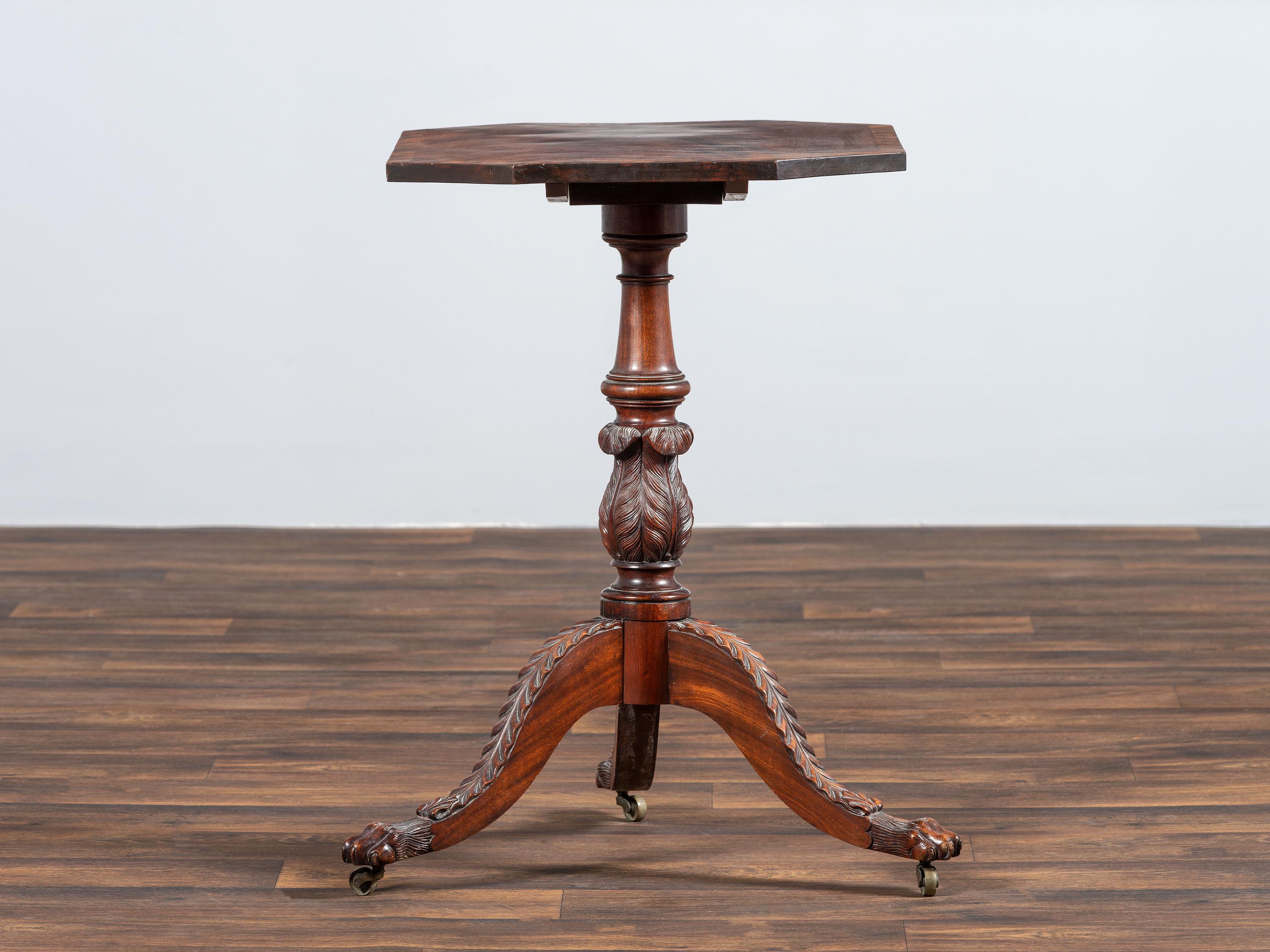 A Late Federal Carved and Figured Mahogany Octagonal Tilt-Top Candlestand