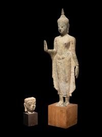 A Thai Bronze Figure of Standing Buddha and a Head of Buddha