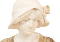 A Continental Carved Alabaster Bust of a Young Maiden