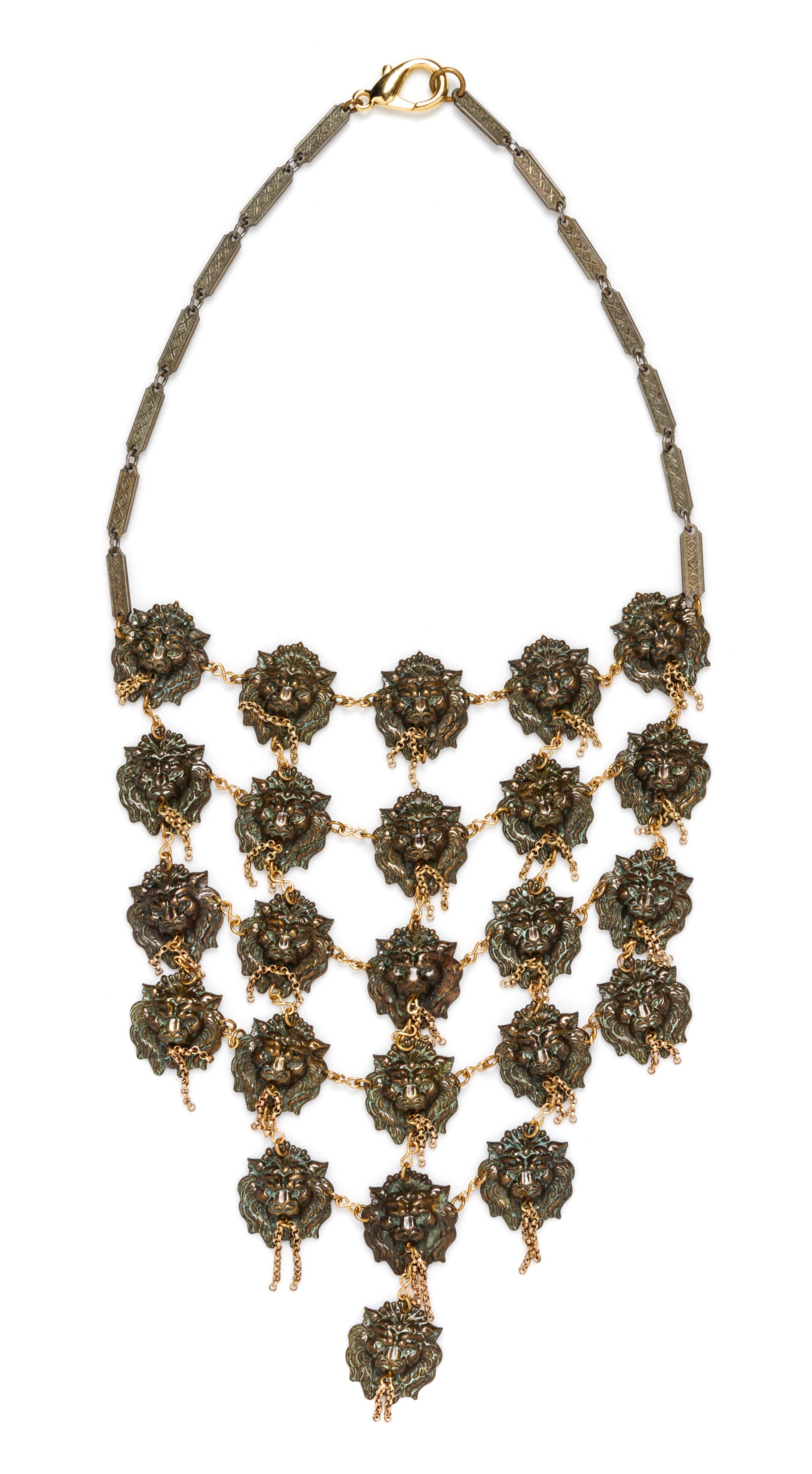 A Coppertone Chain Link Lion Head Bib Necklace.