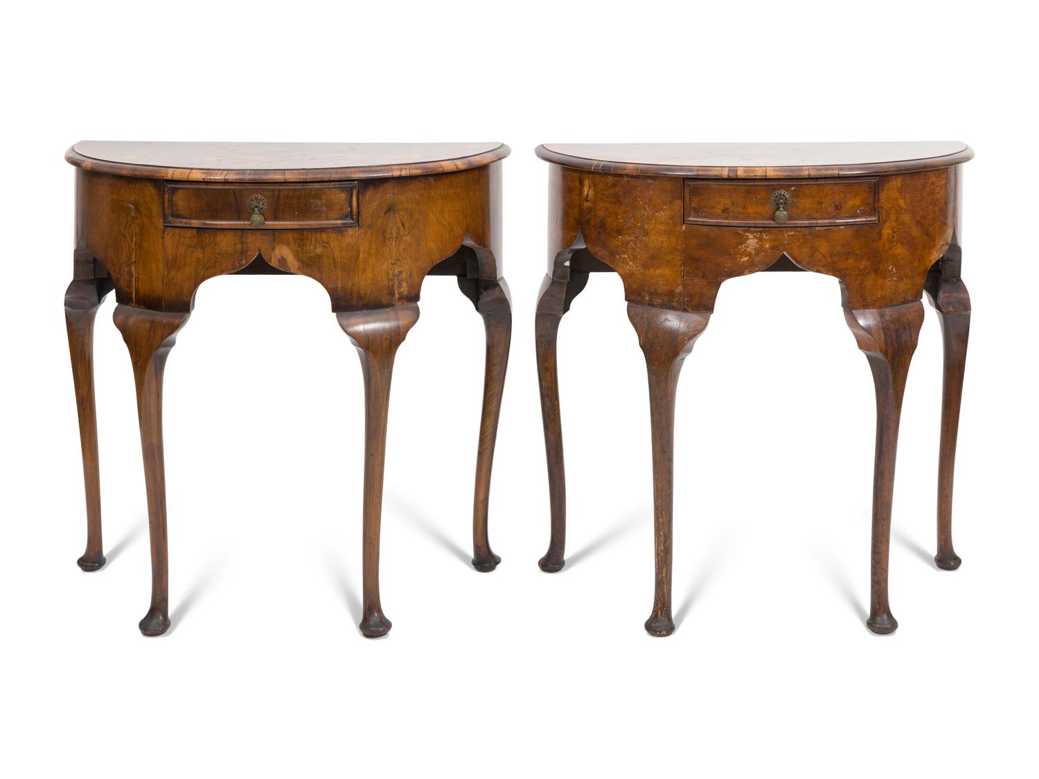 A Pair of Georgian Style Burl Walnut Demilune Console Tables